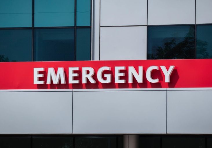 Front entrance of ER Katy in Katy, TX, showing bold red "Emergency" signage on a modern building—signifying 24/7 local emergency medical care.